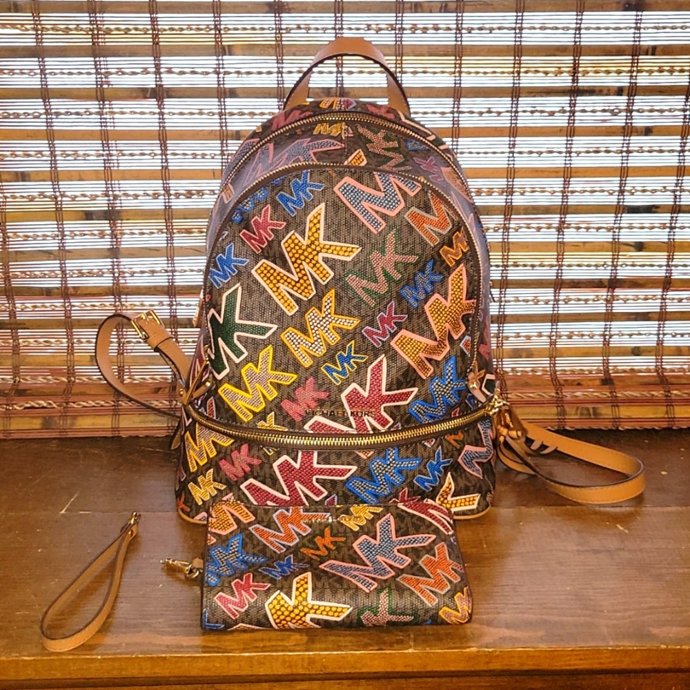 Micheal Kors Zip brown multi colored backpack purse with matching wristlet
